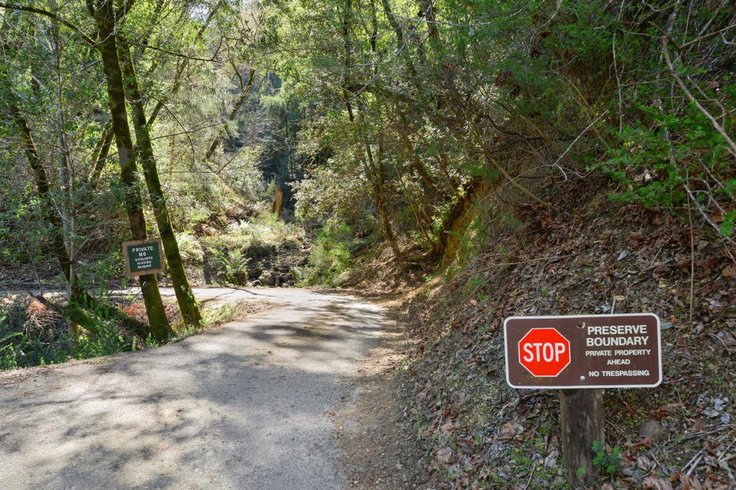 5588 Alpine Road Portola Valley, CA 94028 - Photo 5 of 38 a sign that is sitting on a brick wall