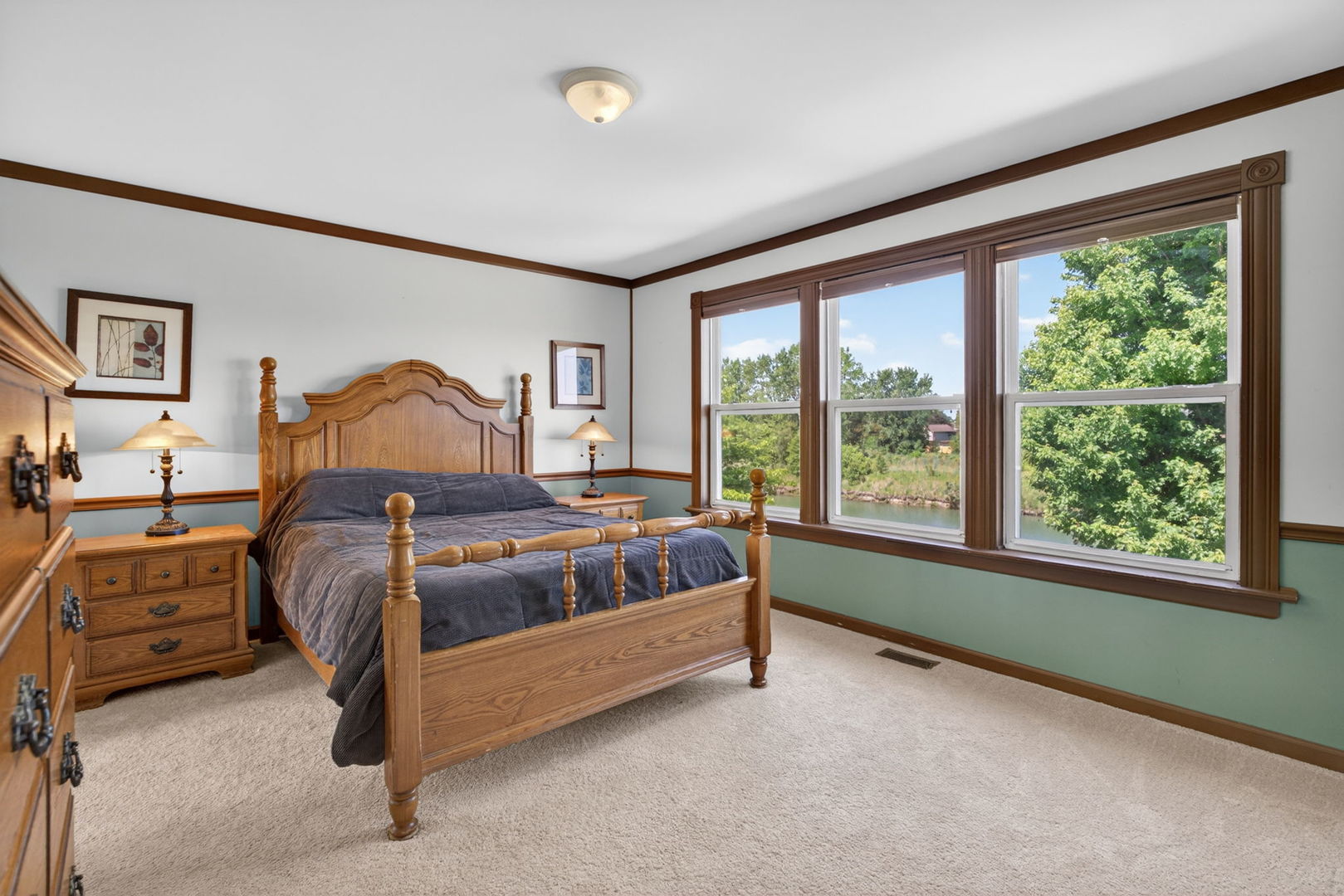 25204 Spring Street Manhattan, IL 60442 - Photo 15 of 34 a bed sitting in a bedroom next to a window