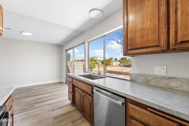 a kitchen with a sink and cabinets