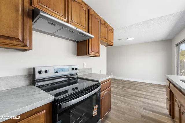 a kitchen with a stove and a microwave