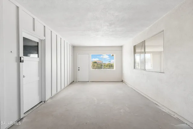 an empty room with windows