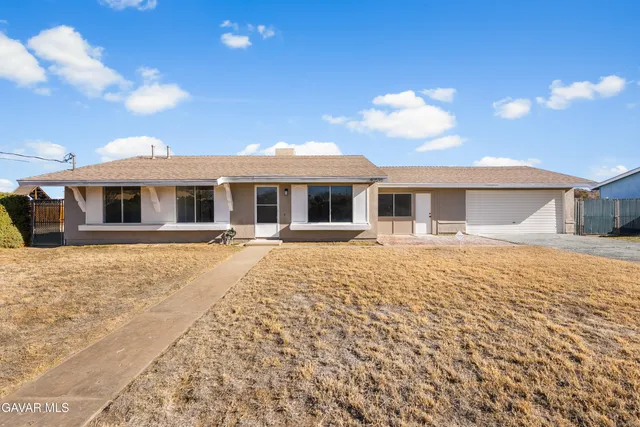 a house with yard in front of it