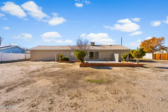 a view of a house with a yard and garage