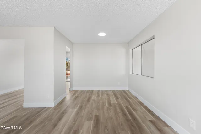 a view of wooden floor in an empty room