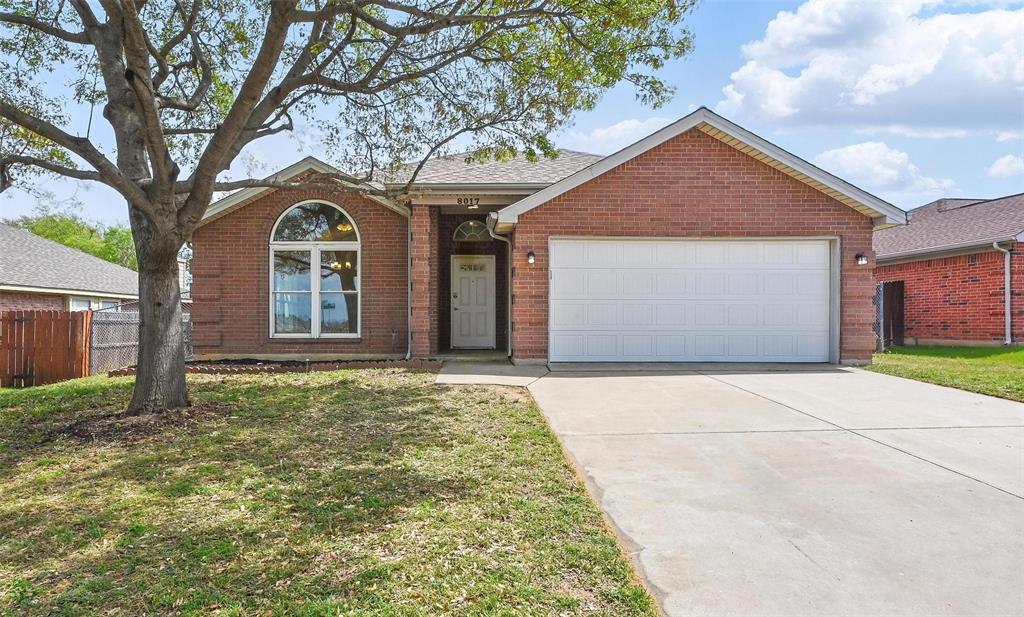8017 Natalie Drive Fort Worth, TX 76134 - Photo 1 of 1 Ranch-style house featuring fence, a garage, a front yard, brick siding, and driveway