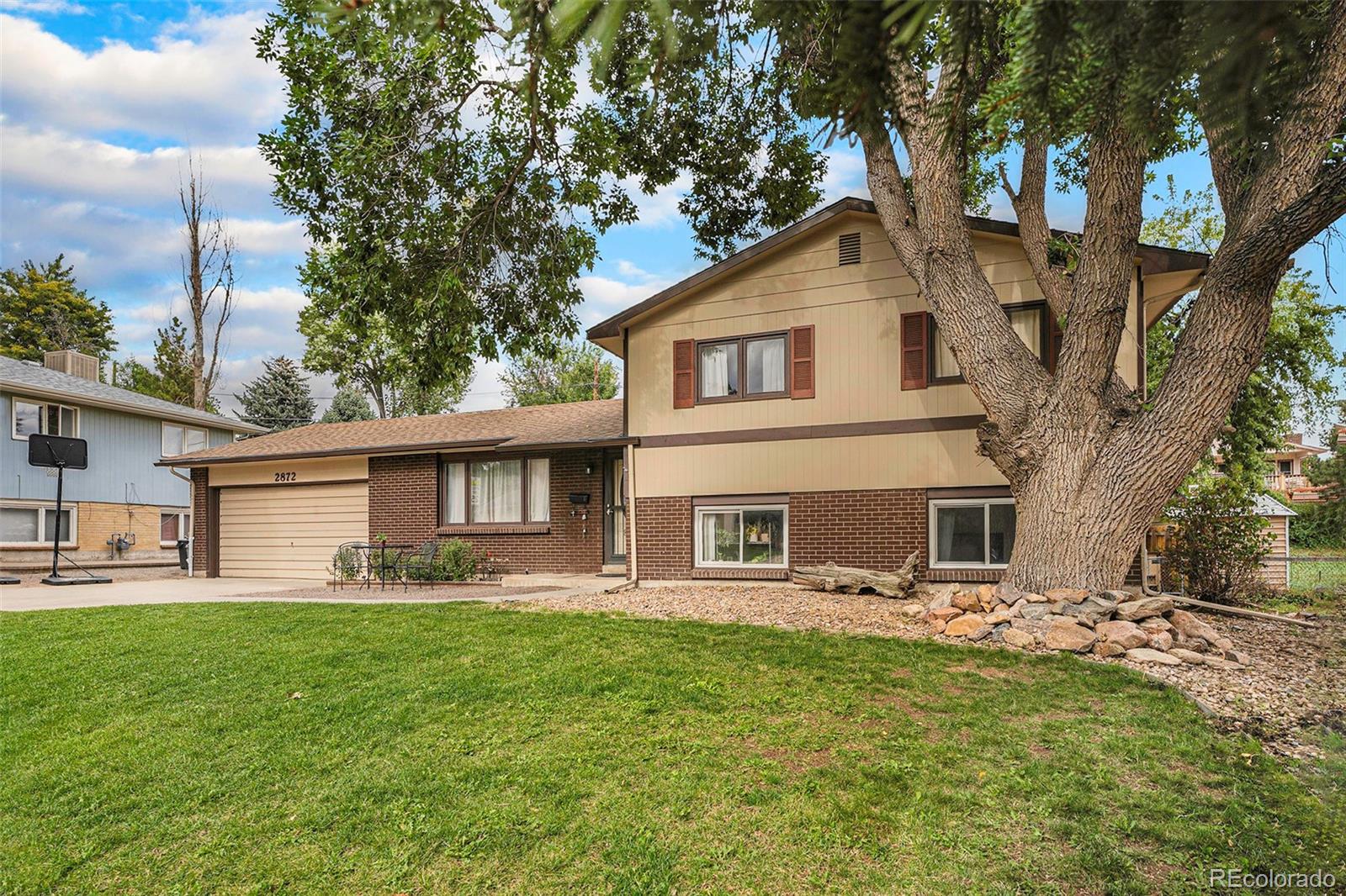 2872 South Gray Way Denver, CO 80227 - Photo 1 of 35 a front view of house with yard and green space