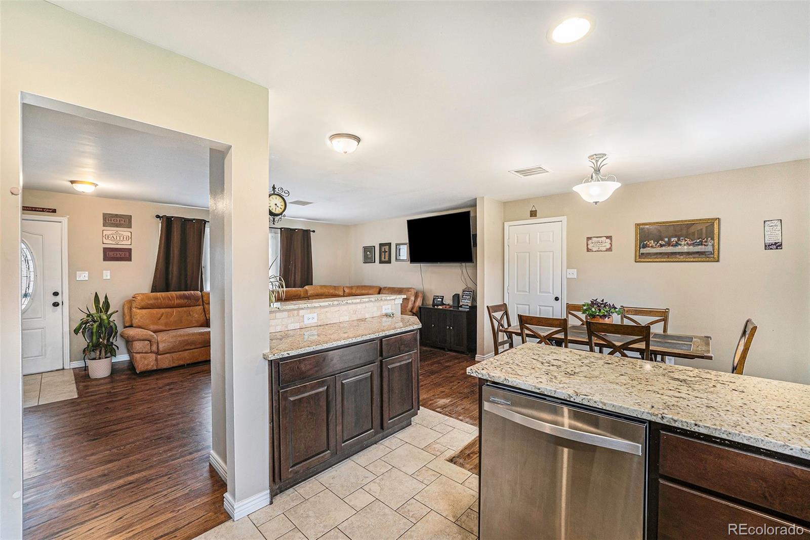 2872 South Gray Way Denver, CO 80227 - Photo 13 of 35 a kitchen with sink stove and cabinets