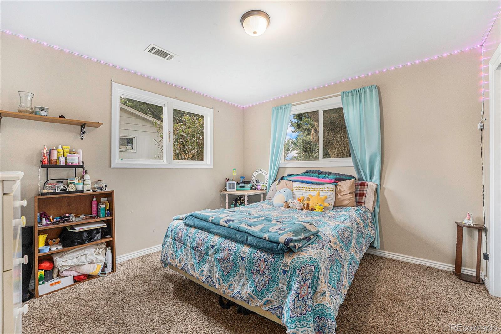 2872 South Gray Way Denver, CO 80227 - Photo 19 of 35 a bedroom that has a bed and a window
