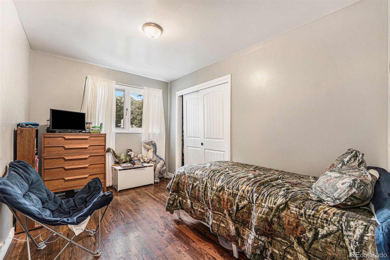 2872 South Gray Way Denver, CO 80227 - Photo 25 of 35 a bedroom with a bed and furniture