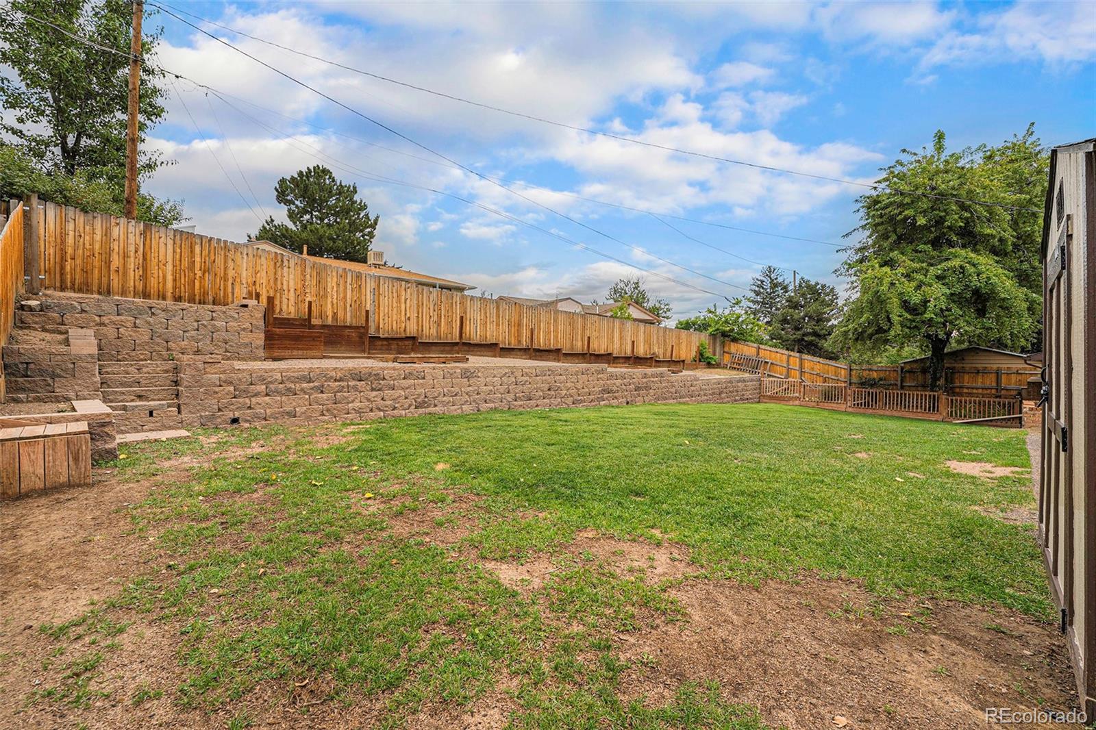2872 South Gray Way Denver, CO 80227 - Photo 30 of 35 a view of a yard with wooden fence