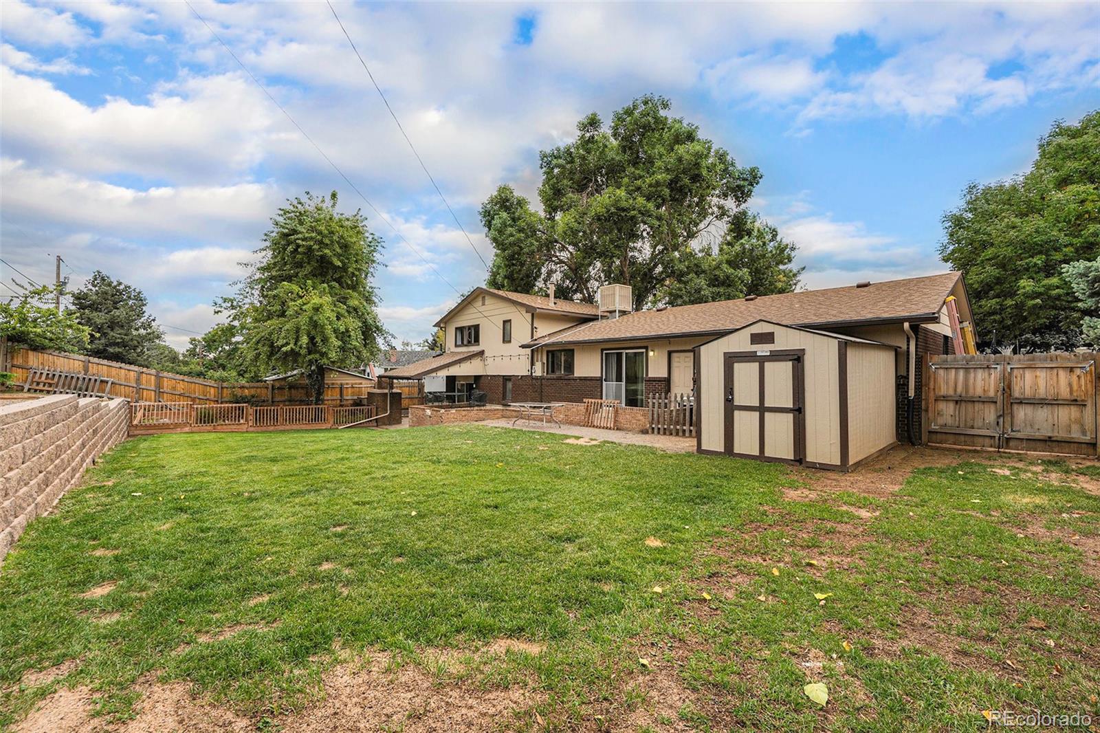 2872 South Gray Way Denver, CO 80227 - Photo 31 of 35 a view of a house with backyard and garden