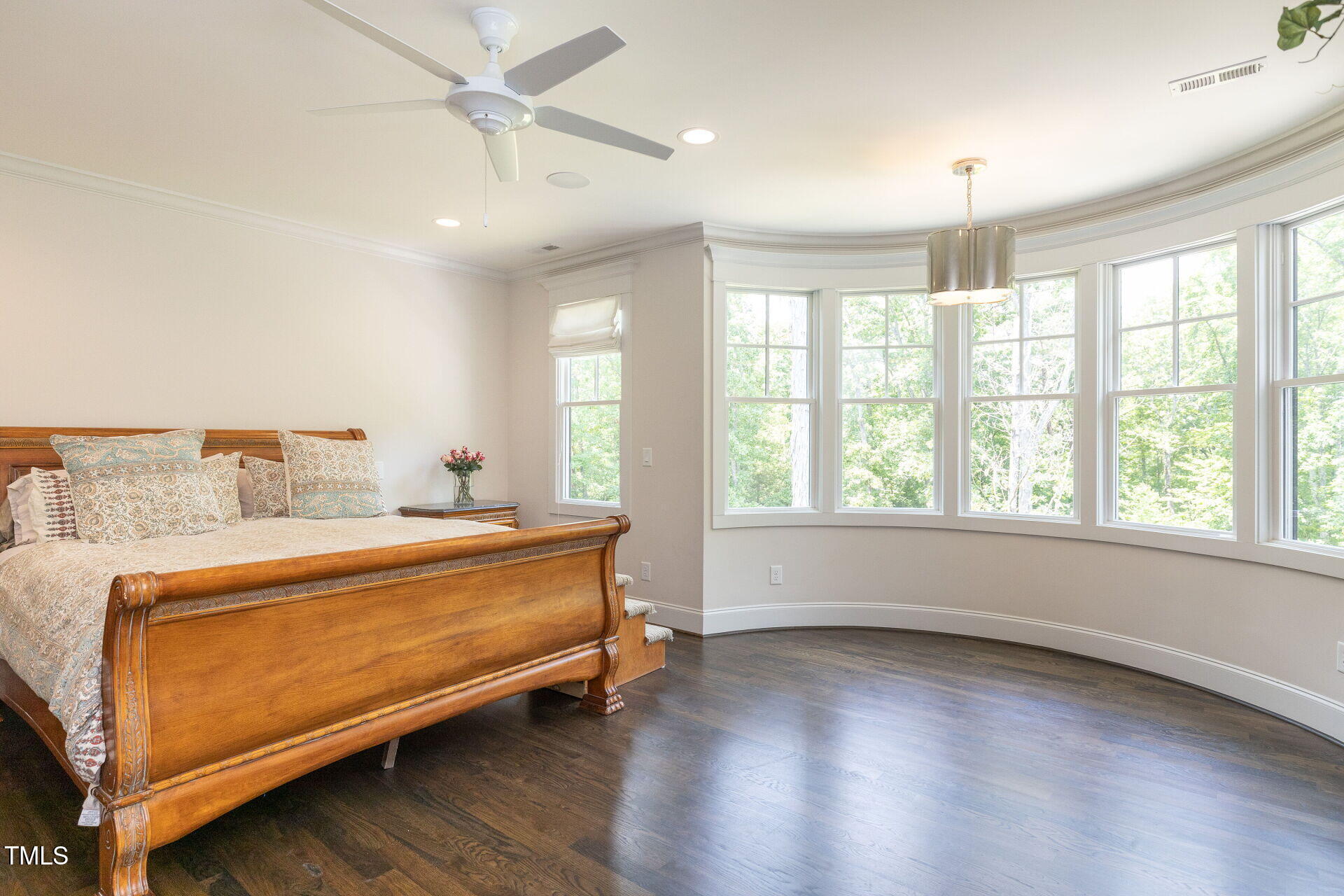 235 Parker Road Chapel Hill, NC 27517 - Photo 22 of 63 a spacious bedroom with a bed and wooden floor
