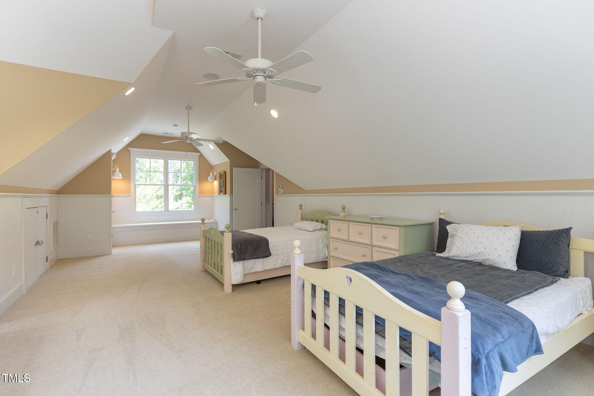 235 Parker Road Chapel Hill, NC 27517 - Photo 40 of 63 a bedroom with a large bed and a chandelier
