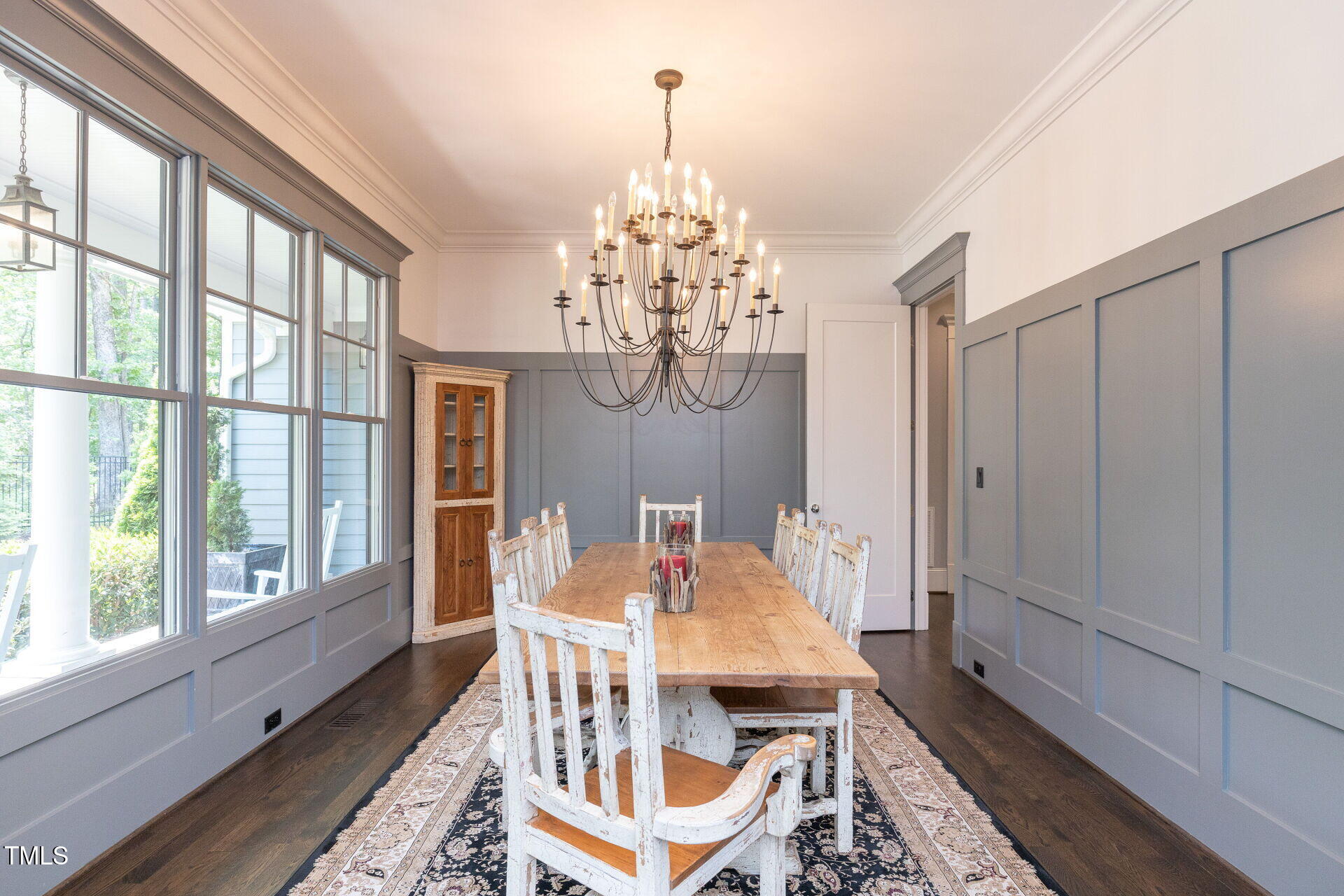 235 Parker Road Chapel Hill, NC 27517 - Photo 4 of 63 a dining room with furniture a chandelier and wooden floor