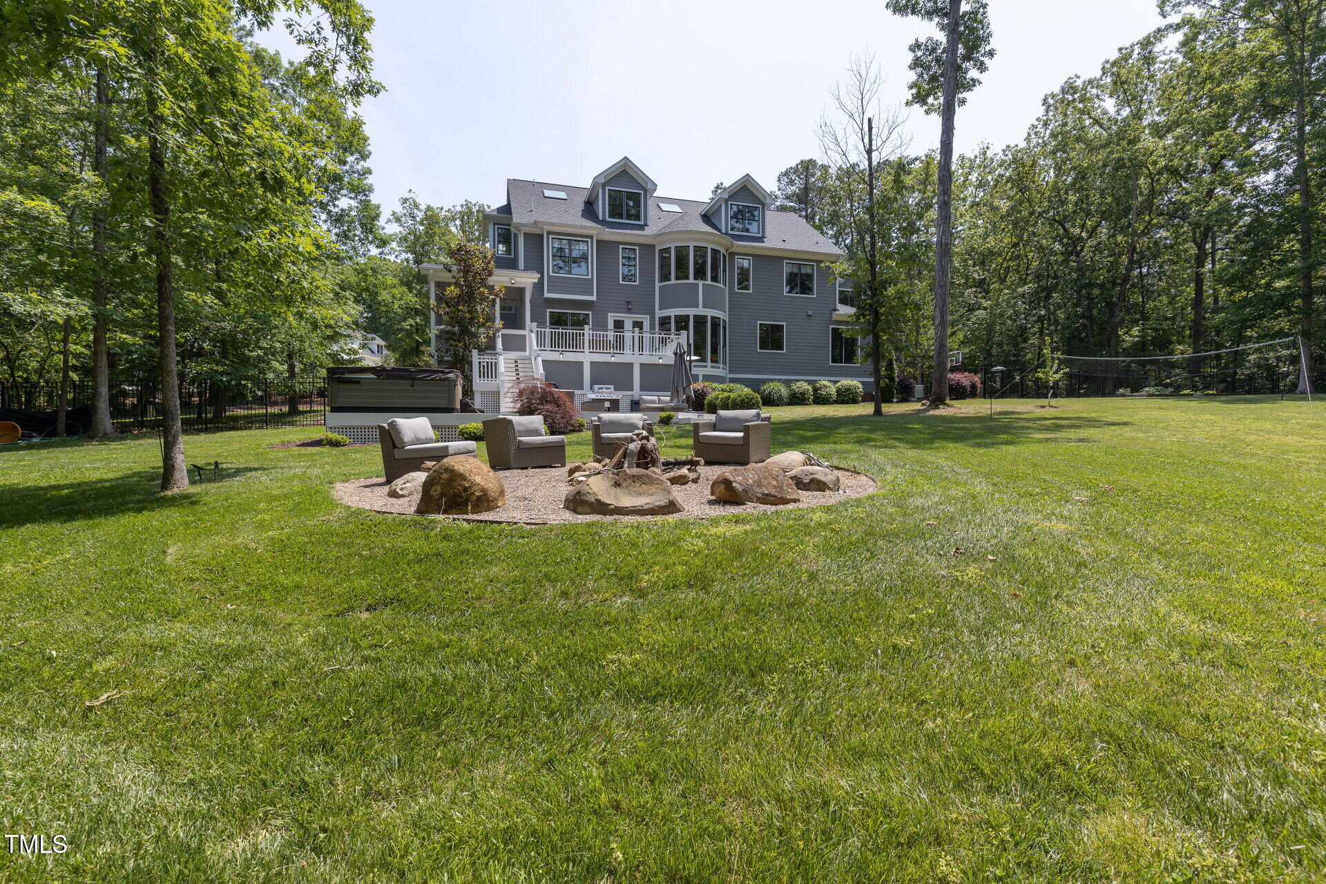235 Parker Road Chapel Hill, NC 27517 - Photo 58 of 63 a view of a big yard with a patio and a garden