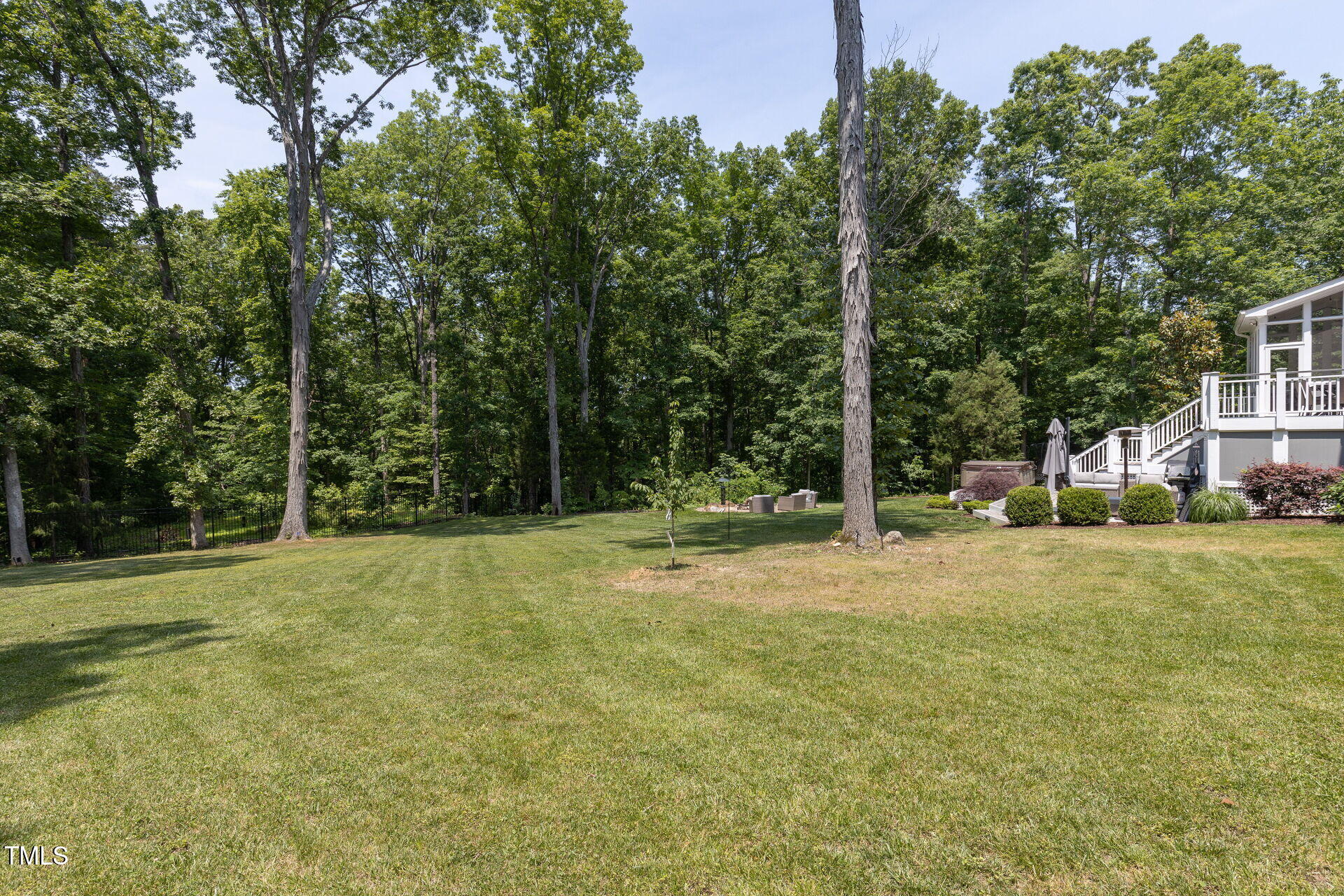 235 Parker Road Chapel Hill, NC 27517 - Photo 60 of 63 a backyard of a house with lots of green space
