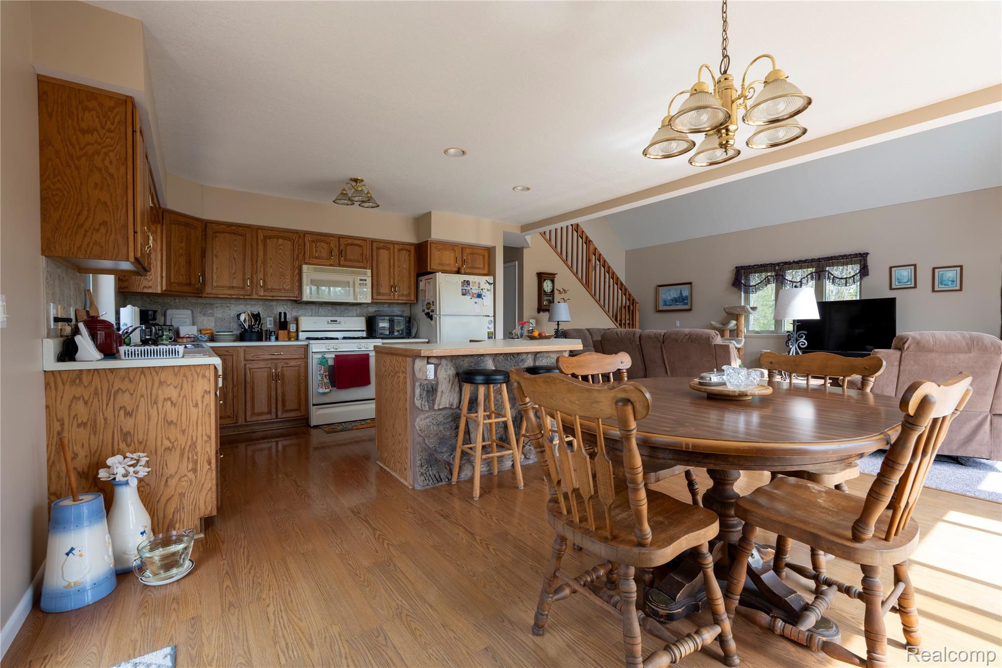 4180 Sage Lake Road Lupton, MI 48635 - Photo 7 of 40 Dining area featuring hanging lights and light wood finished floors