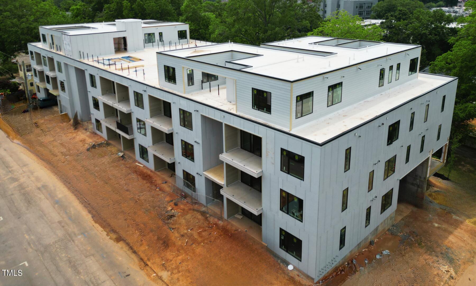 29 Enterprise Street, Unit 310 Raleigh, NC 27607 - Photo 1 of 3 a view of a building with roof deck