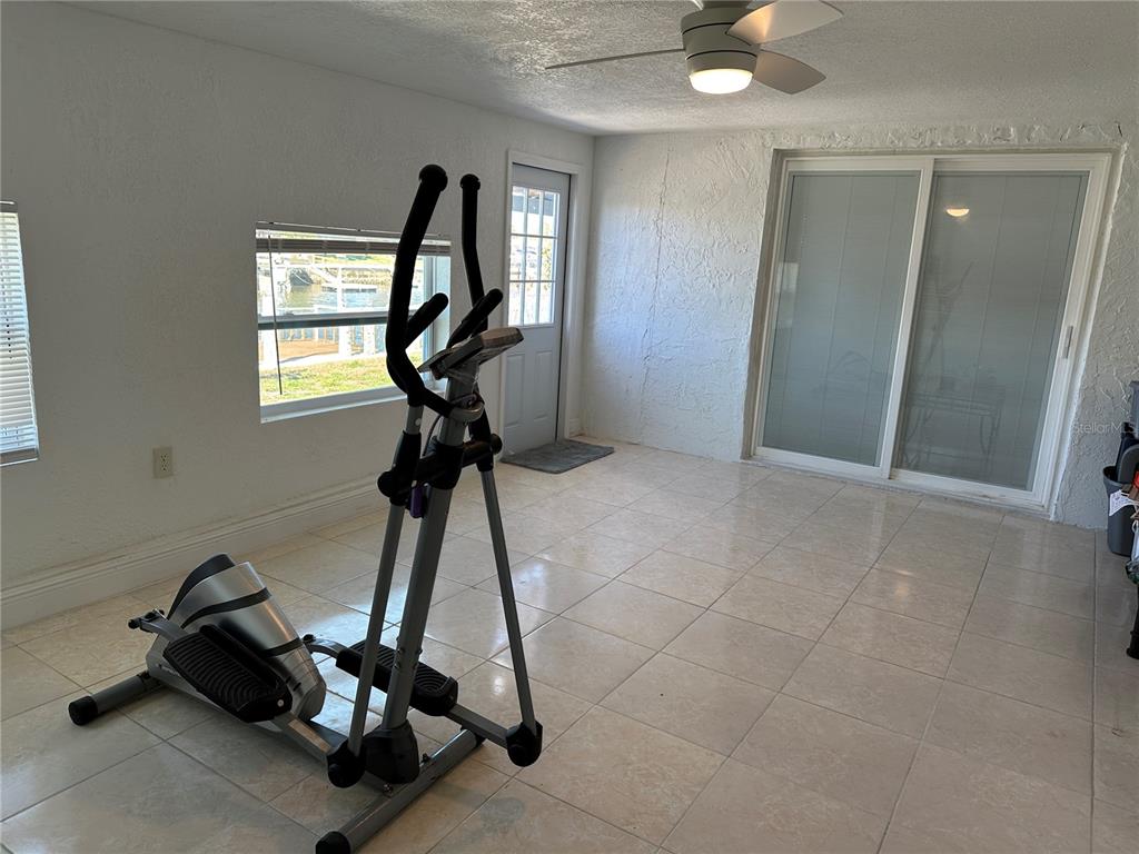 12613 4th Isle Hudson, FL 34667 - Photo 13 of 42 a view of gym equipment