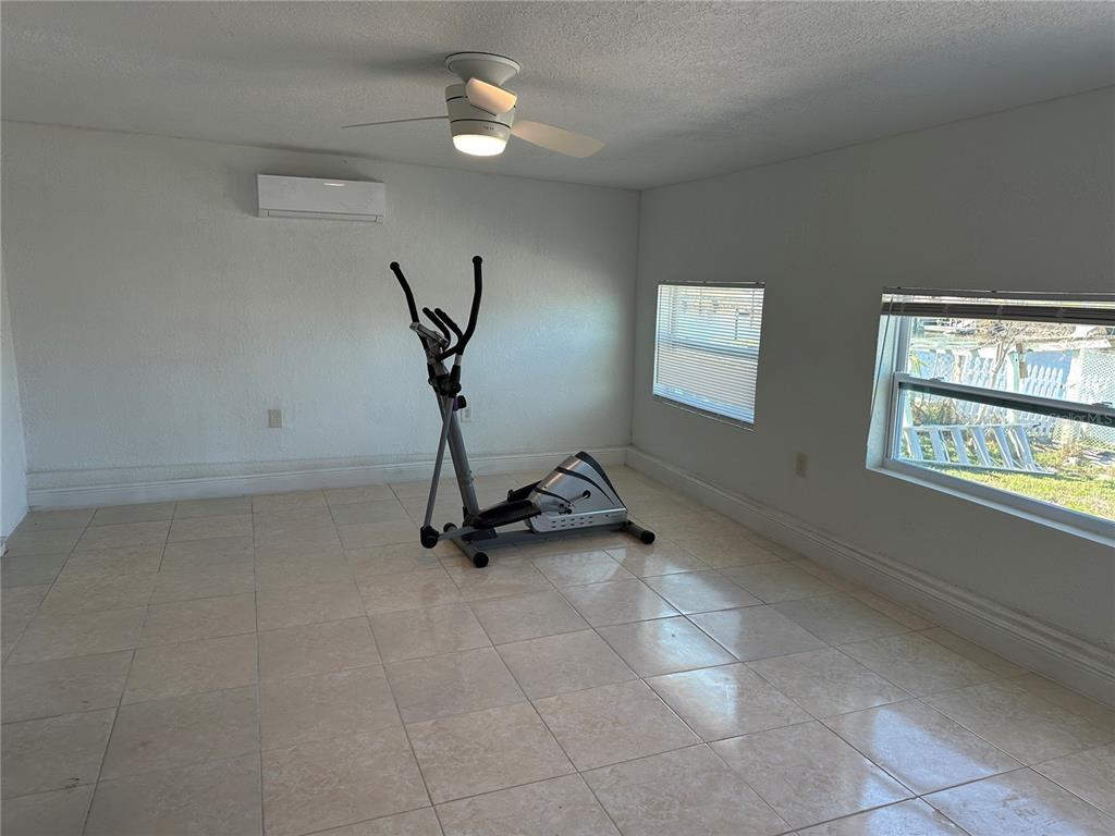 12613 4th Isle Hudson, FL 34667 - Photo 15 of 42 a view of a room with gym equipment