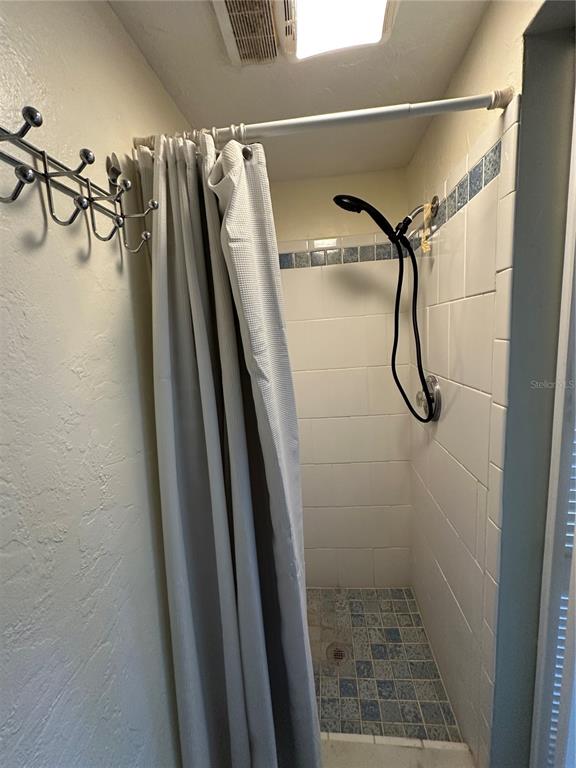 12613 4th Isle Hudson, FL 34667 - Photo 23 of 42 a bathroom with a shower