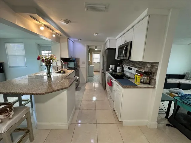 a view of a room with storage and utility room