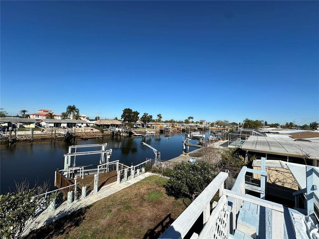 12613 4th Isle Hudson, FL 34667 - Photo 34 of 42 a view of a lake with a city