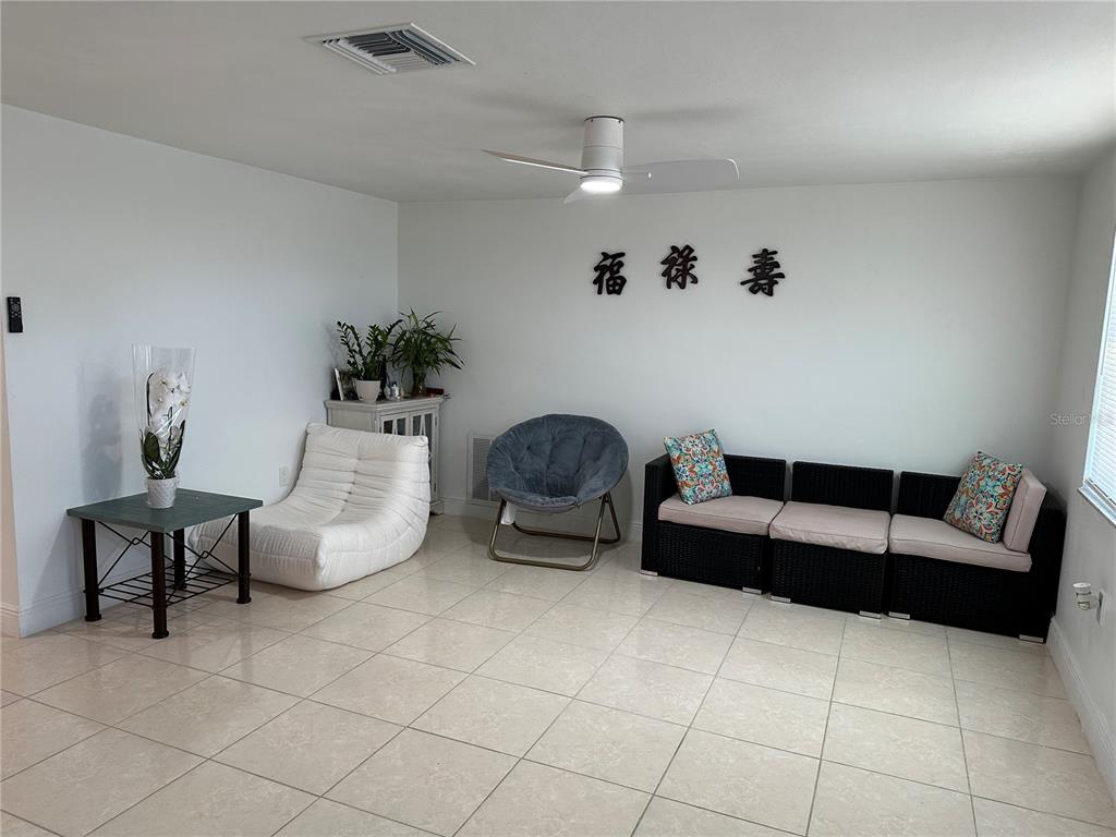 12613 4th Isle Hudson, FL 34667 - Photo 4 of 42 a living room with furniture and a couch