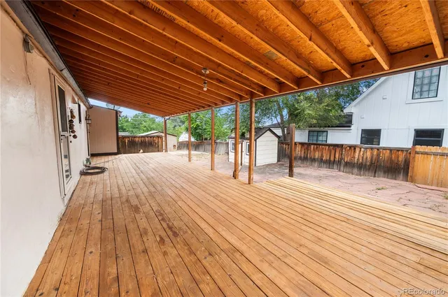a view of outdoor space with wooden floor and outdoor seating