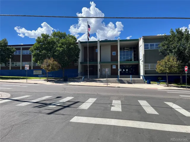 a view of a building with a street sign