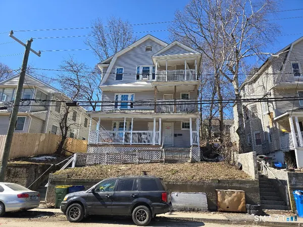 a car parked in front of a house