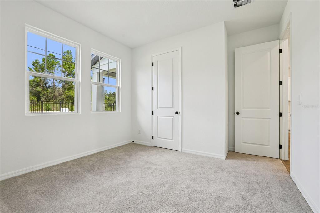 2491 Zuni Road St. Cloud, FL 34771 - Photo 17 of 42 a view of an empty room with a window