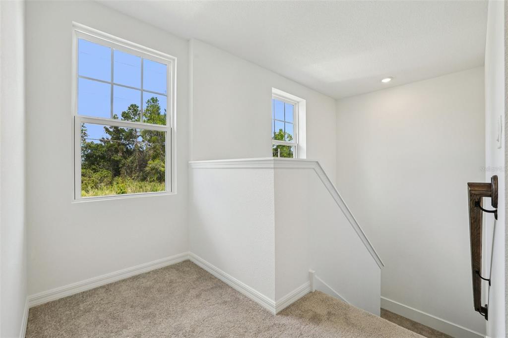 2491 Zuni Road St. Cloud, FL 34771 - Photo 21 of 42 a view of hallway with window and stairs