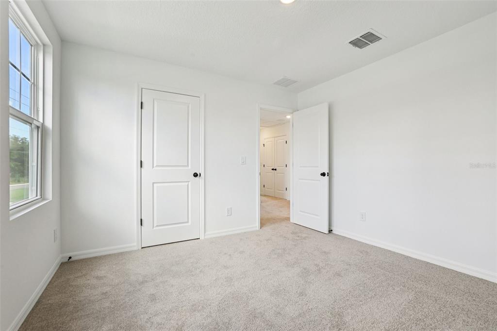 2491 Zuni Road St. Cloud, FL 34771 - Photo 24 of 42 a view of an empty room with a window