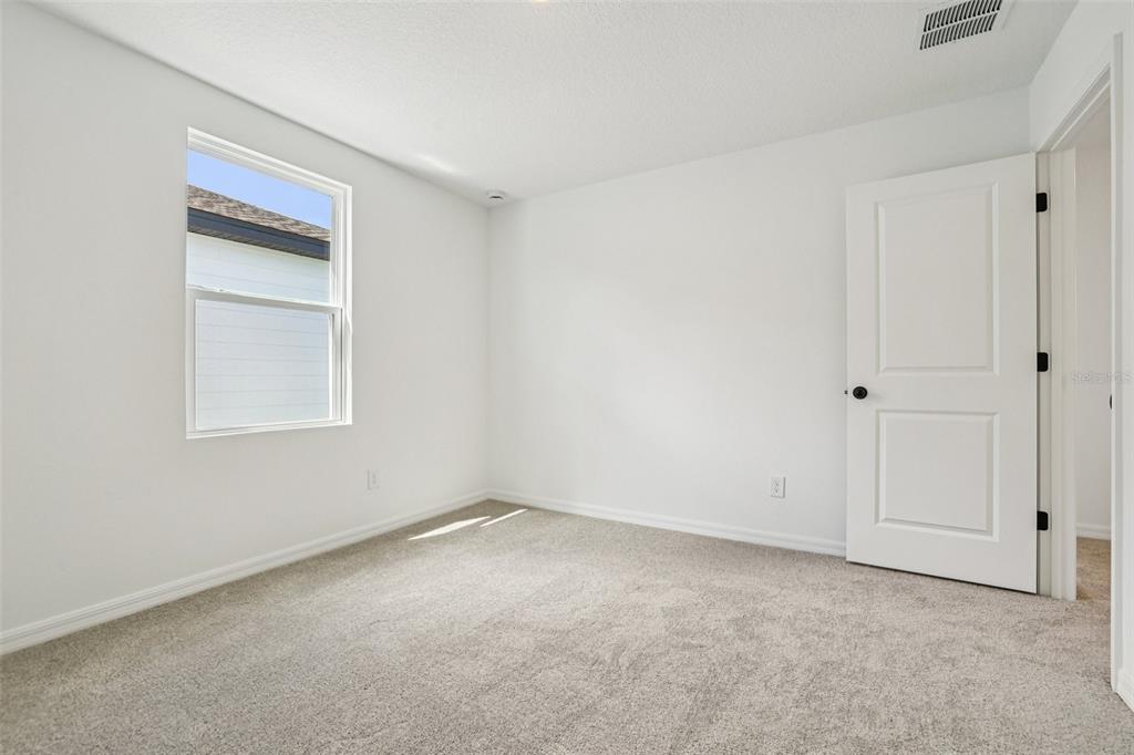 2491 Zuni Road St. Cloud, FL 34771 - Photo 27 of 42 a view of an empty room with a window