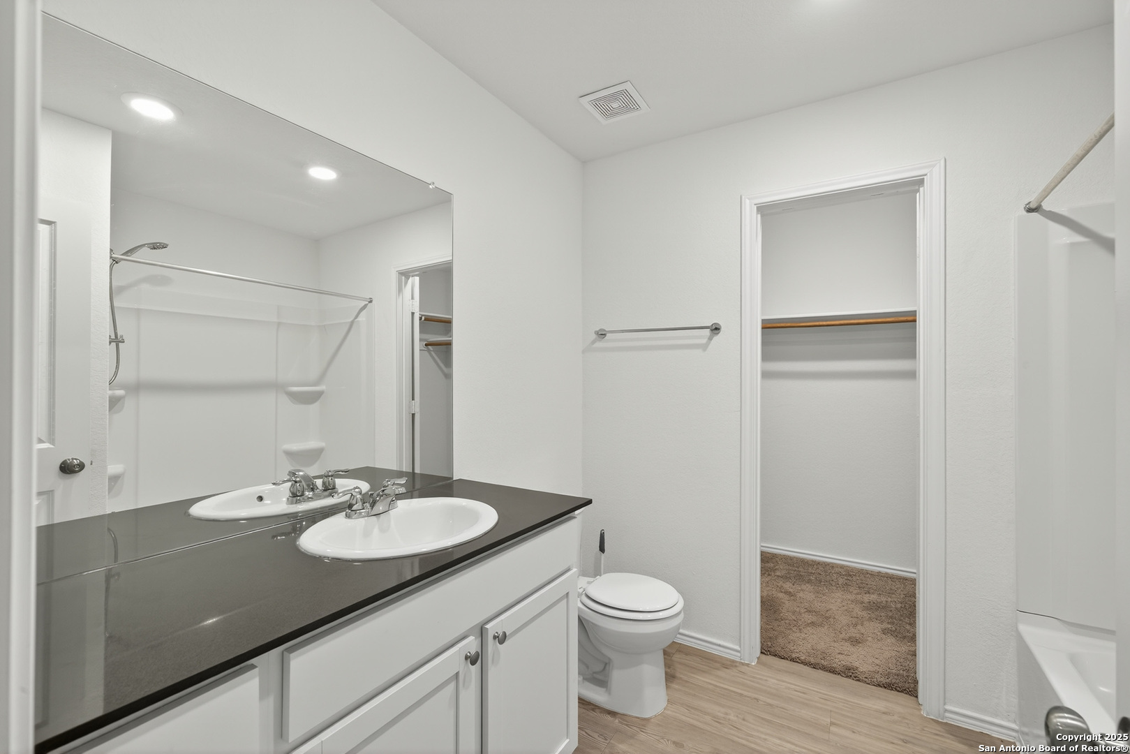 10716 Sweepback Trail Converse, TX 78109 - Photo 15 of 26 a bathroom with a granite countertop sink toilet and shower