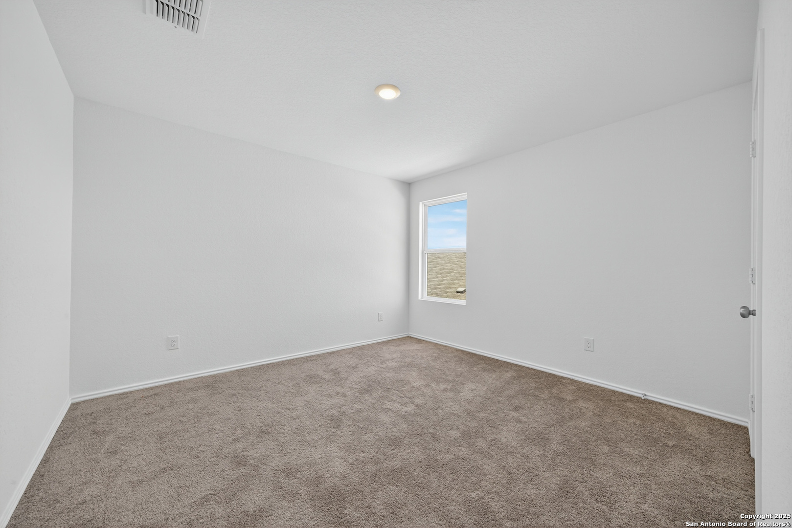 10716 Sweepback Trail Converse, TX 78109 - Photo 18 of 26 a view of an empty room and a window
