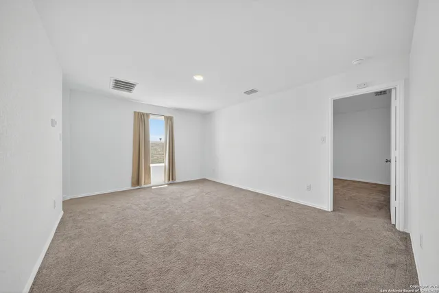 a view of an empty room and window