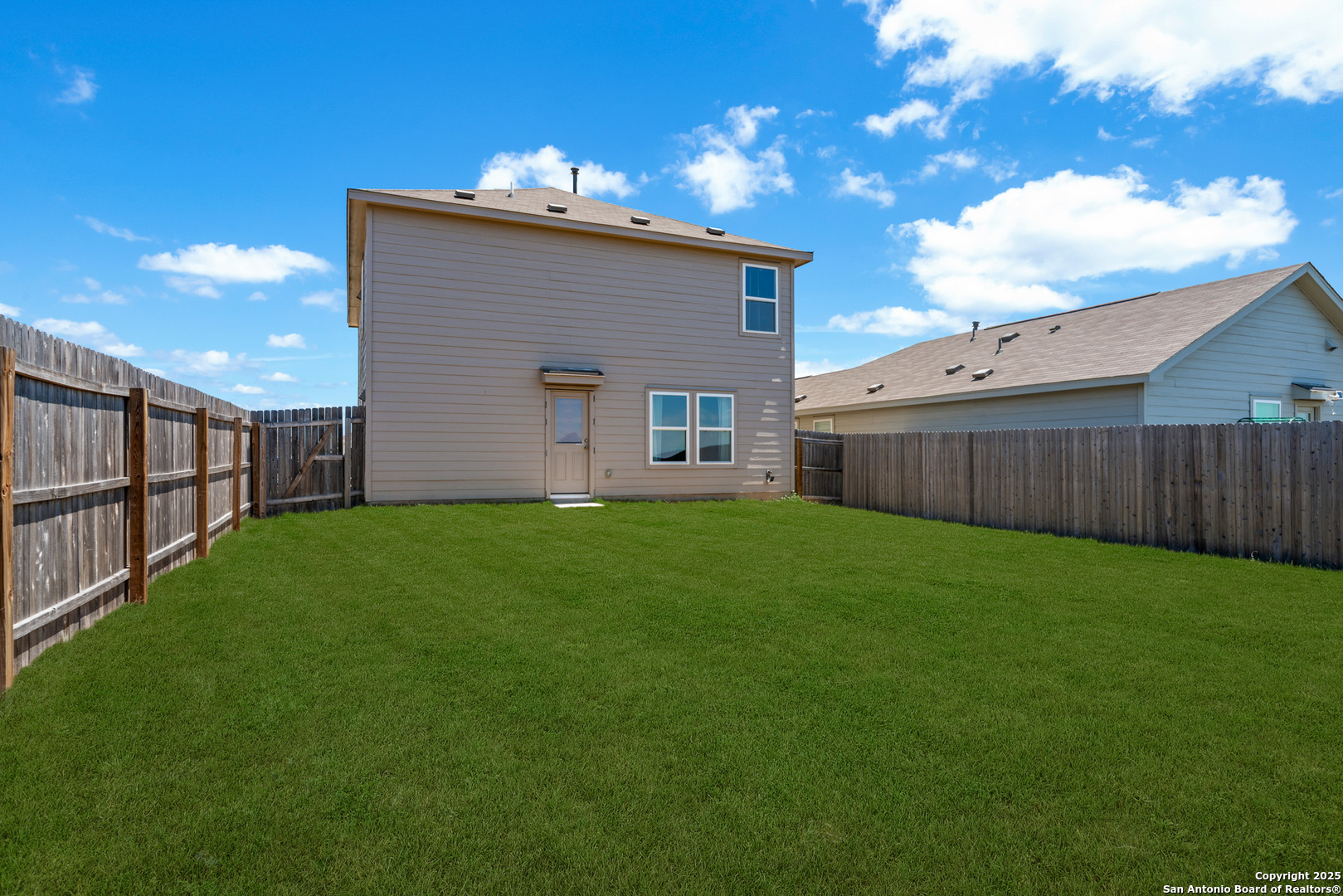 10716 Sweepback Trail Converse, TX 78109 - Photo 24 of 26 a view of a backyard with plants and a garden