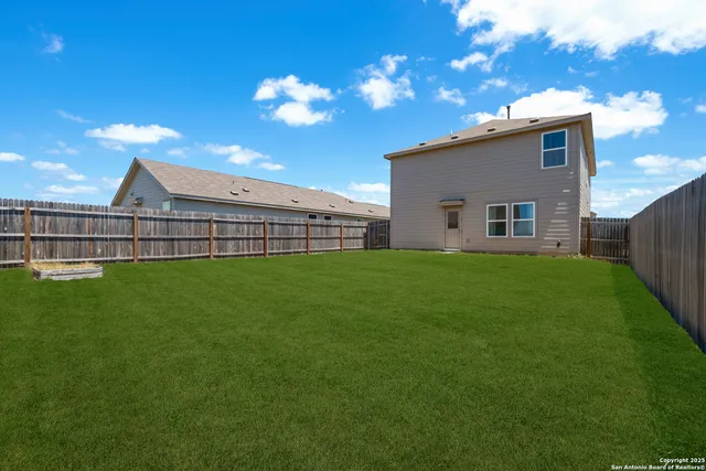 a view of a house with a back yard