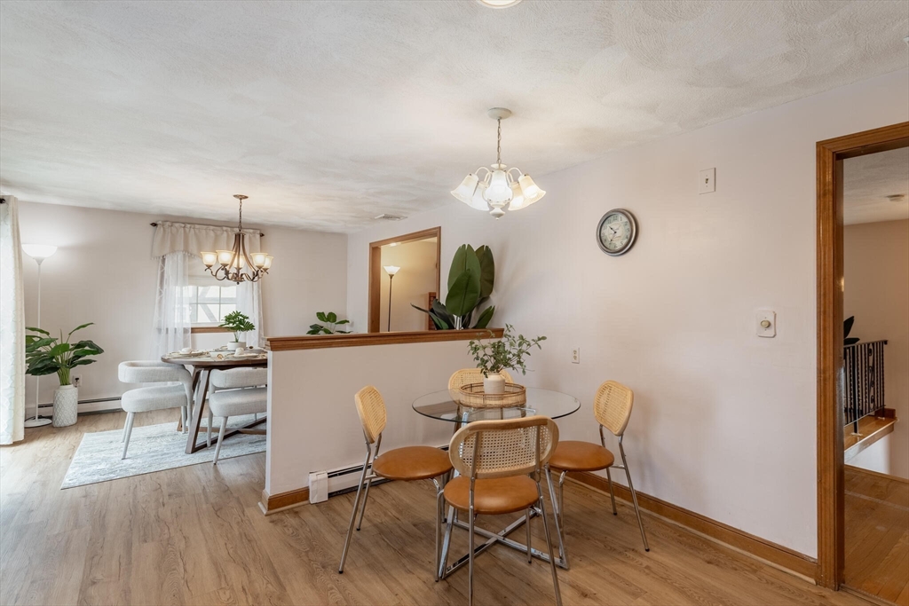 2 Rodgers Road Stoneham, MA 02180 - Photo 12 of 38 a view of a dining room with furniture and wooden floor