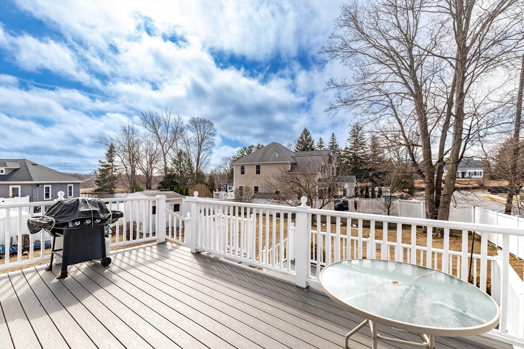 2 Rodgers Road Stoneham, MA 02180 - Photo 15 of 38 a balcony with wooden floor table and chairs
