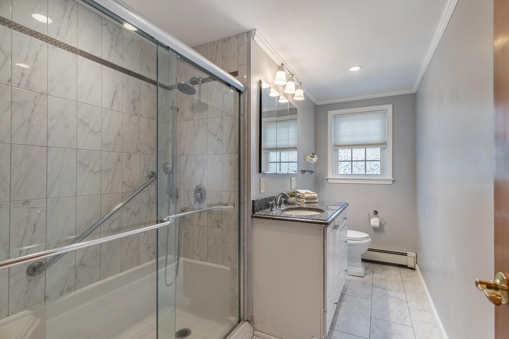 2 Rodgers Road Stoneham, MA 02180 - Photo 21 of 38 a bathroom with a granite countertop sink a toilet and shower