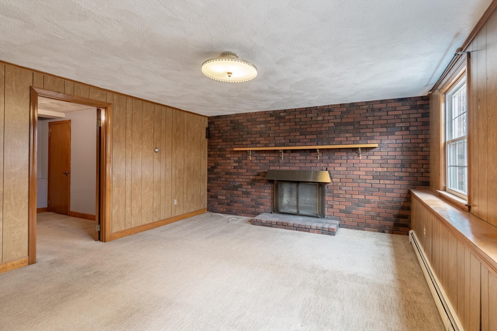2 Rodgers Road Stoneham, MA 02180 - Photo 23 of 38 a view of empty room with a fireplace