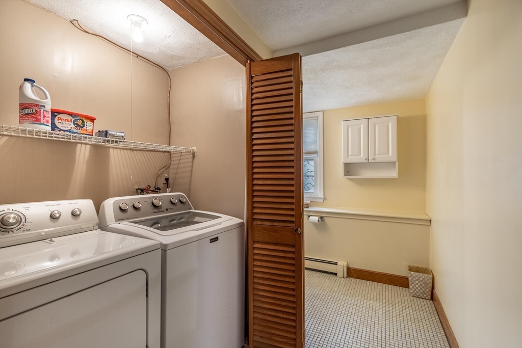 2 Rodgers Road Stoneham, MA 02180 - Photo 27 of 38 a utility room with dryer and washer