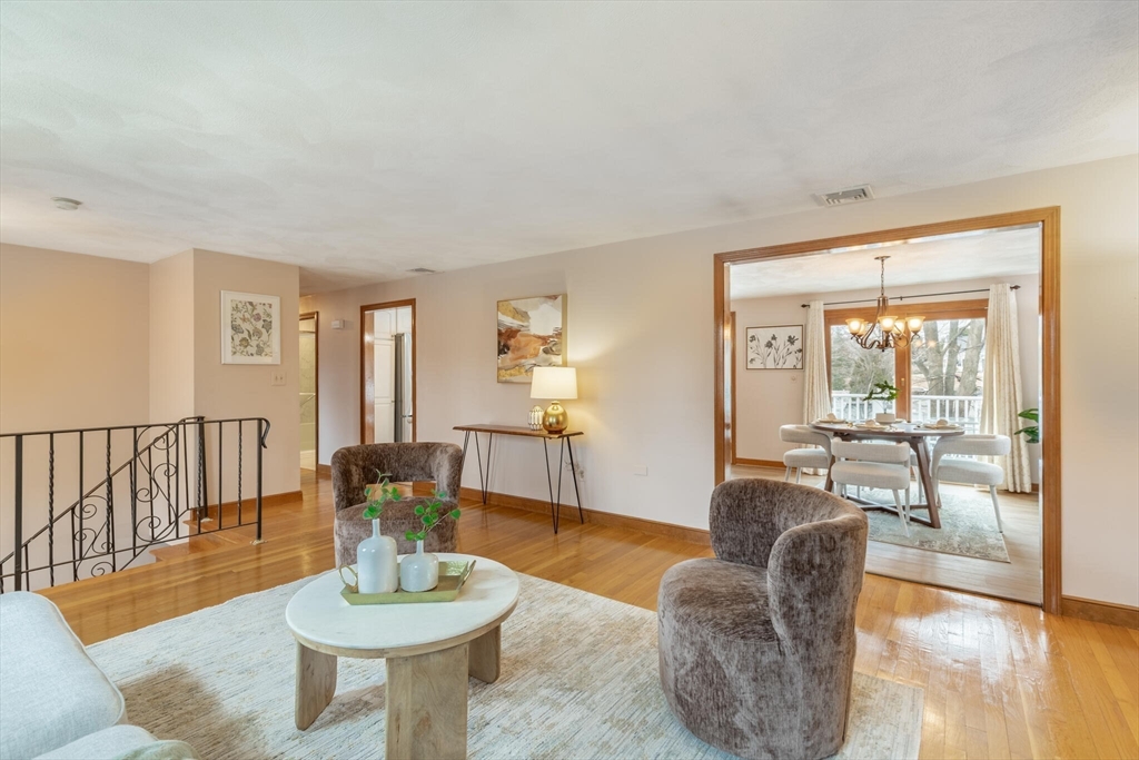 2 Rodgers Road Stoneham, MA 02180 - Photo 7 of 38 a living room with furniture and a wooden floor