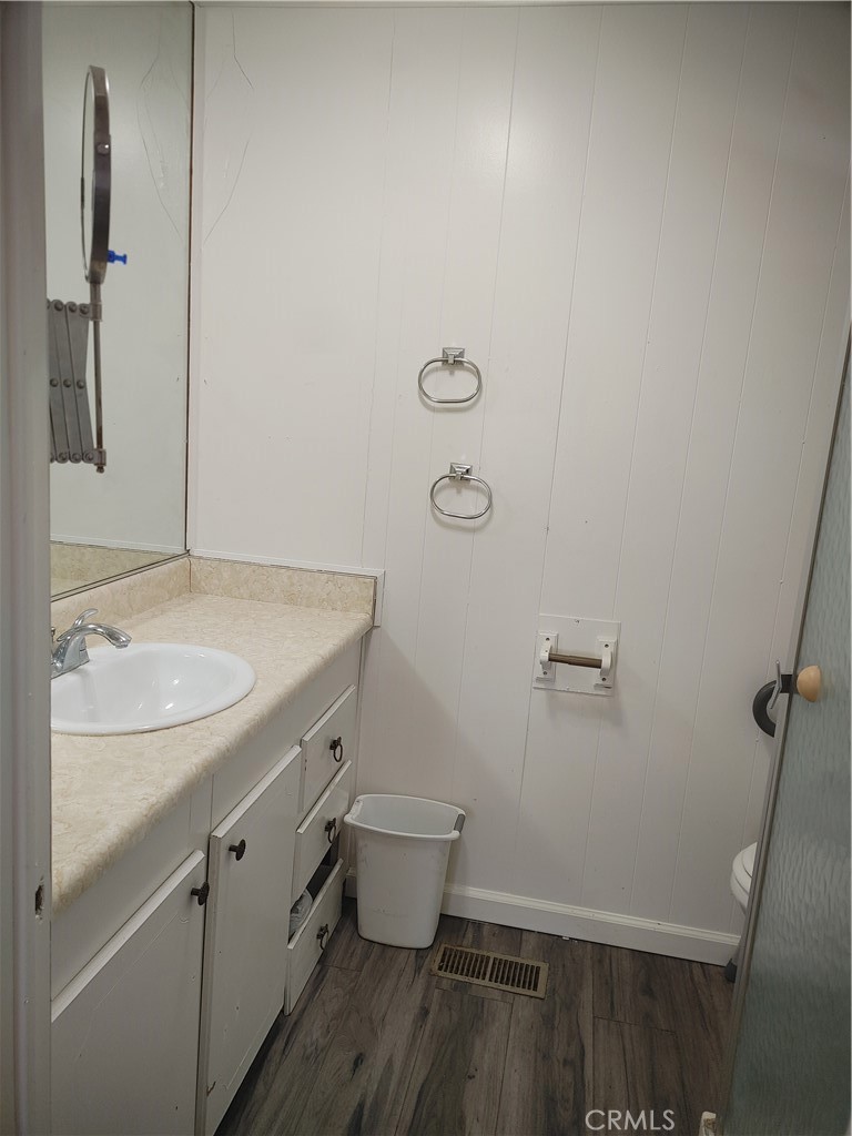 13645 5th Street, Unit 75 Yucaipa, CA 92399 - Photo 12 of 12 a bathroom with a granite countertop sink toilet and shower