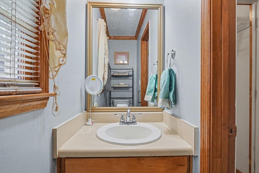 114 Copeland Lane Stockbridge, GA 30281 - Photo 17 of 40 a bathroom with a sink and a mirror