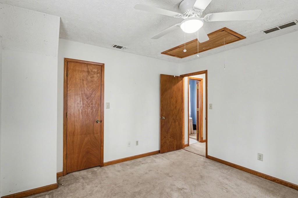114 Copeland Lane Stockbridge, GA 30281 - Photo 25 of 40 an empty room with a ceiling fan and closet