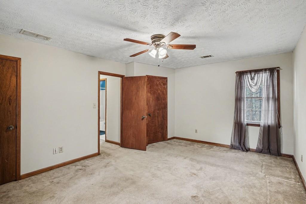 114 Copeland Lane Stockbridge, GA 30281 - Photo 29 of 40 an empty room with closet and a chandelier fan